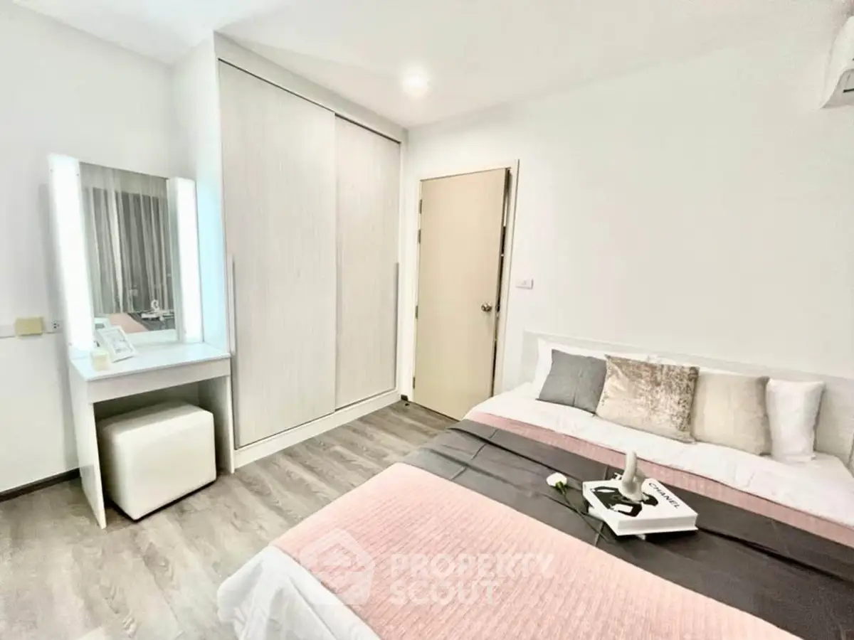 Cozy bedroom with modern decor and ample storage space