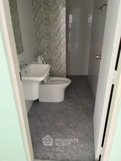 Modern bathroom with stylish tile design and sleek fixtures