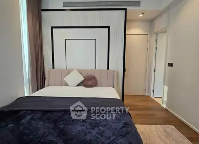 Modern bedroom with stylish decor and cozy bedding