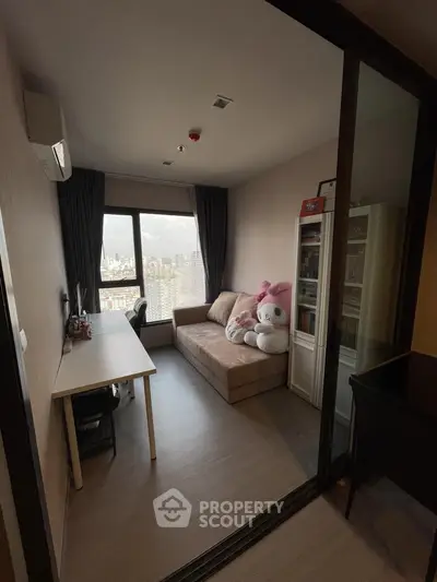 Cozy study room with city view, featuring a sofa, desk, and bookshelf, perfect for work or relaxation.