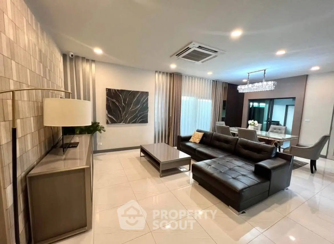 Spacious modern living room with elegant decor and open layout, perfect for entertaining.