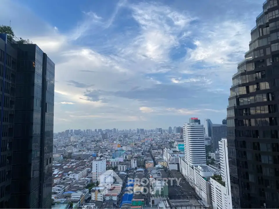 Stunning cityscape view from high-rise building with expansive skyline and modern architecture.