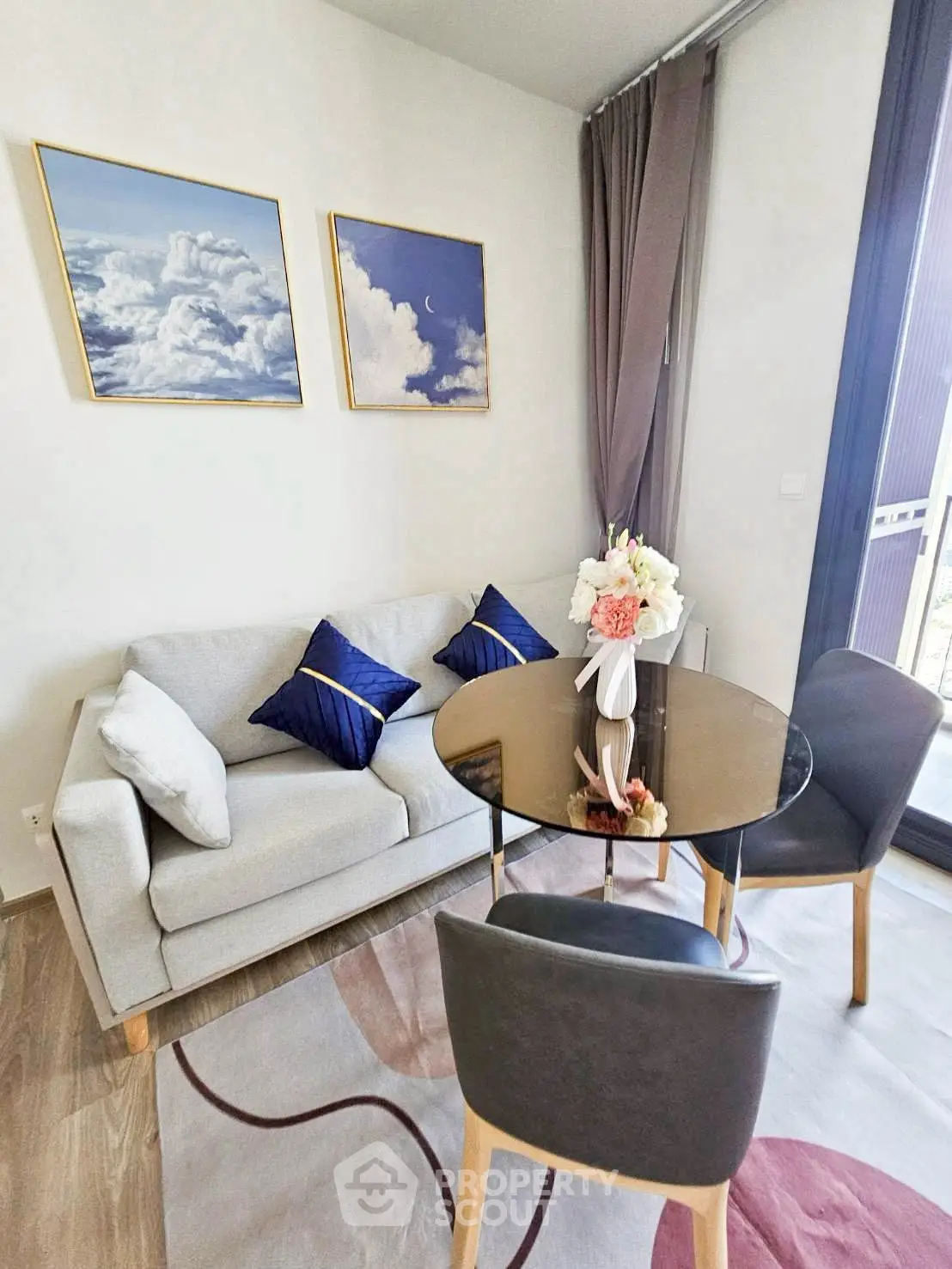 Chic living room with elegant decor, cozy sofa, and stylish dining area, perfect for modern living.