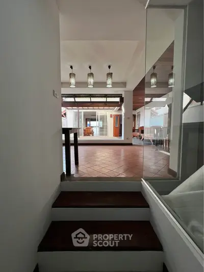 Spacious modern interior with elegant lighting and open layout, perfect for contemporary living.