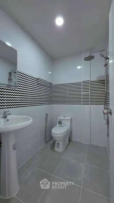 Modern bathroom with sleek design and stylish tile accents