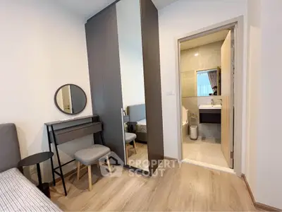 Modern bedroom with ensuite bathroom and stylish furniture