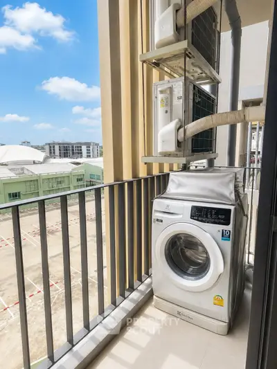 Modern balcony with washing machine and city view, perfect for urban living convenience.