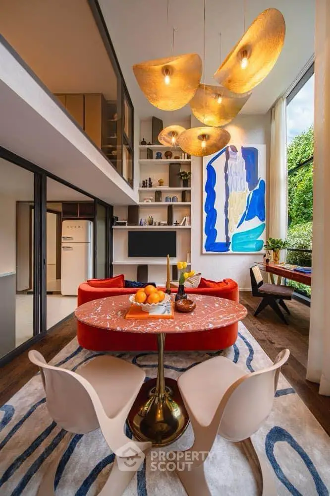 Stunning modern living room with high ceilings, artistic decor, and elegant lighting.