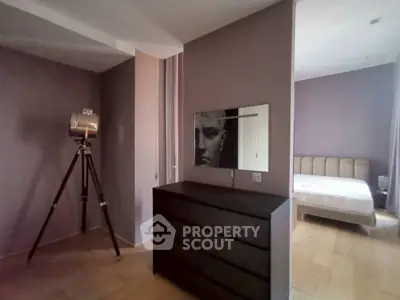 Modern bedroom with stylish decor and wooden flooring