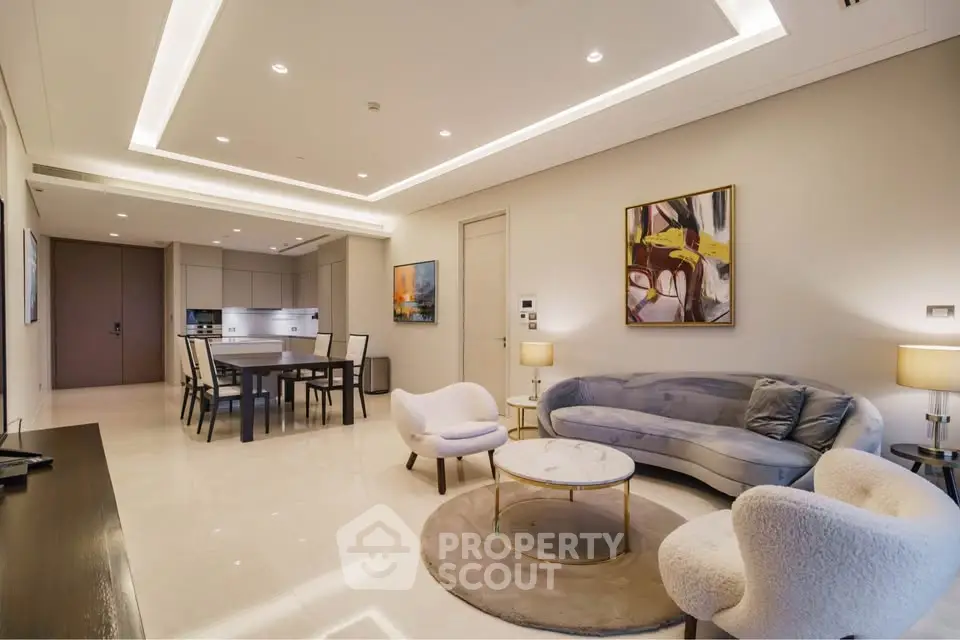 Luxurious modern living room with elegant furniture and open kitchen layout