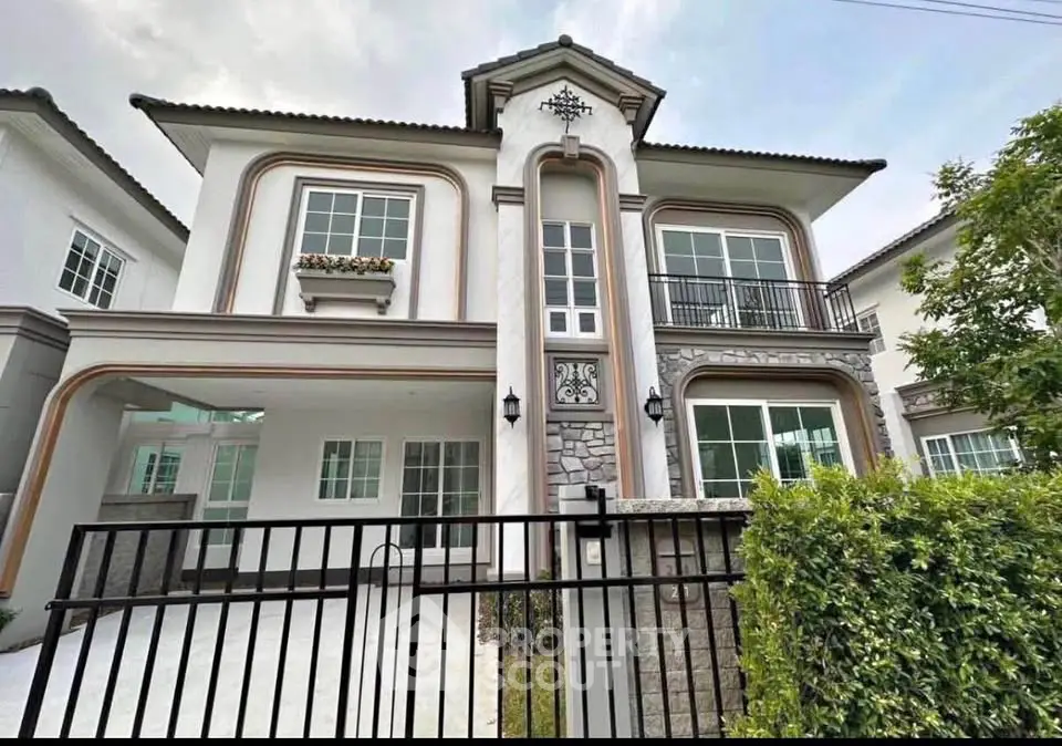 Elegant two-story house with modern architecture and lush greenery, perfect for family living.