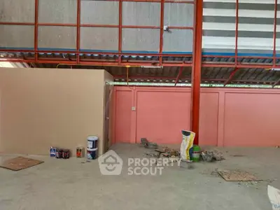 Spacious industrial warehouse interior with high ceilings and ample storage potential.