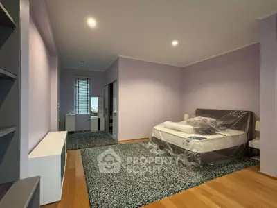 Spacious bedroom with modern decor and natural light
