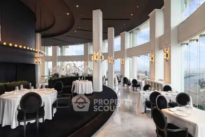Luxurious high-rise restaurant with panoramic city and river views, elegant decor, and sophisticated ambiance.