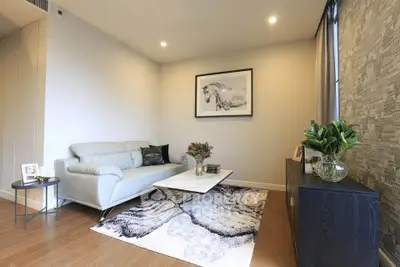 Stylish modern living room with elegant decor and cozy seating area.