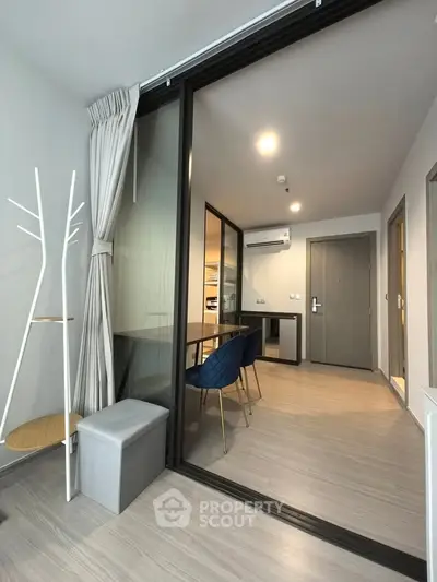 Modern apartment interior with sliding glass doors and stylish furniture