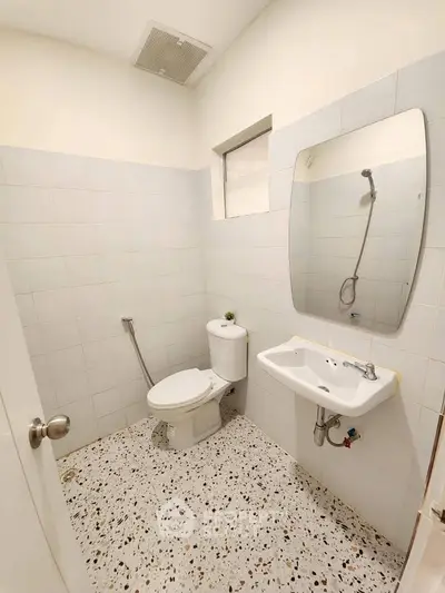 Compact bathroom with modern fixtures and terrazzo flooring