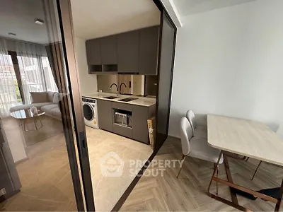 Modern kitchen with open layout and dining area in stylish apartment