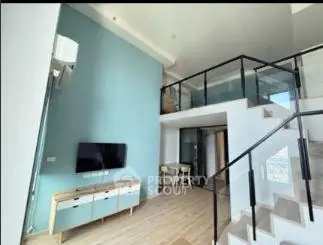 Modern duplex living room with high ceiling and stylish staircase