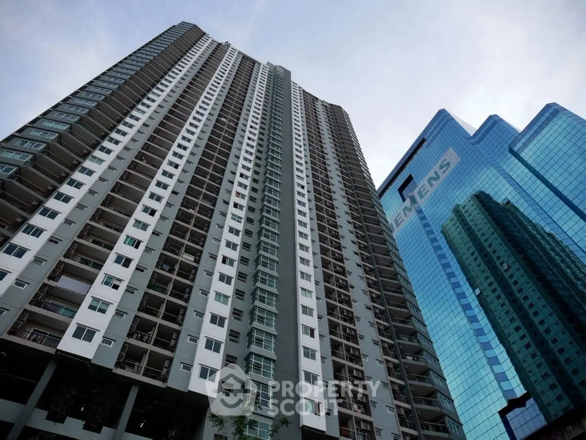 Stunning high-rise apartment building with modern architecture and glass facade.