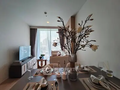 Stylish modern living room with elegant dining setup and natural light