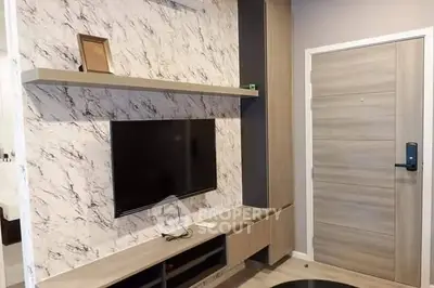 Modern living room with marble accent wall and sleek TV setup