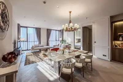 Luxurious open-plan living and dining area with elegant decor and ample natural light.