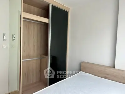 Modern bedroom with sleek built-in wardrobe and minimalist design