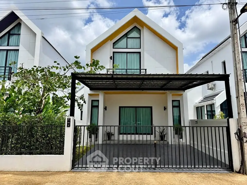 Modern two-story house with sleek design and spacious driveway in a serene neighborhood.