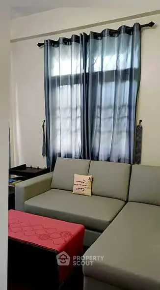 Cozy living room with modern sofa and stylish curtains