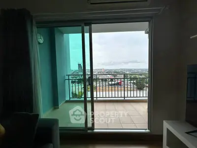 Spacious balcony with stunning city view from modern apartment, perfect for relaxation and enjoying the skyline.