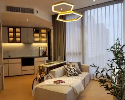 Modern living room with stylish lighting and open kitchen layout