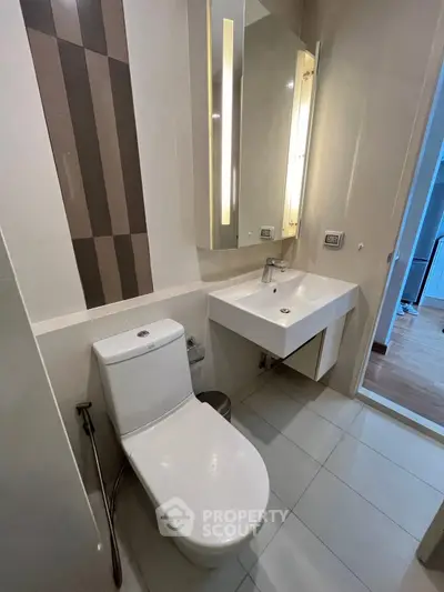 Modern bathroom with sleek fixtures and stylish design in a contemporary apartment.
