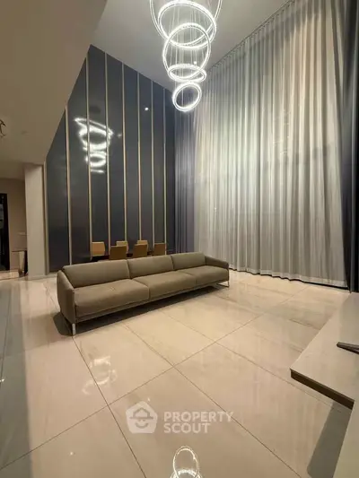 Luxurious modern living room with high ceilings and elegant lighting