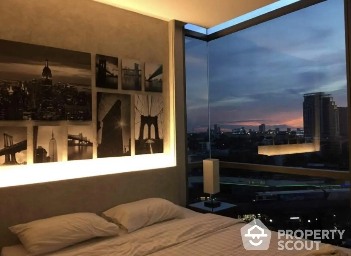 Modern bedroom with stunning city view and artistic wall decor