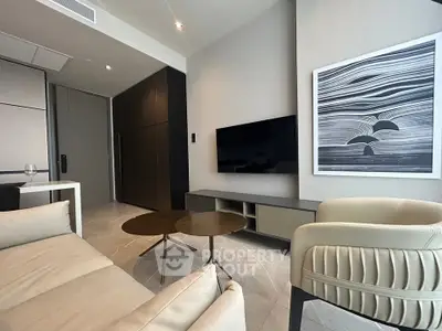 Modern living room with sleek furniture and stylish wall art in a contemporary apartment.