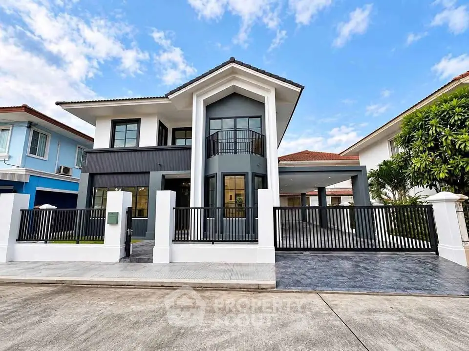 Modern two-story house with sleek design and spacious driveway