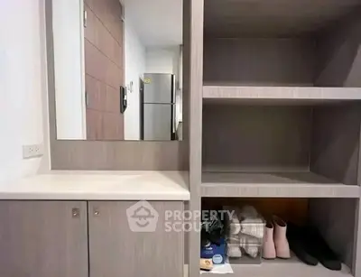 Modern storage area with shelves and mirror in stylish apartment