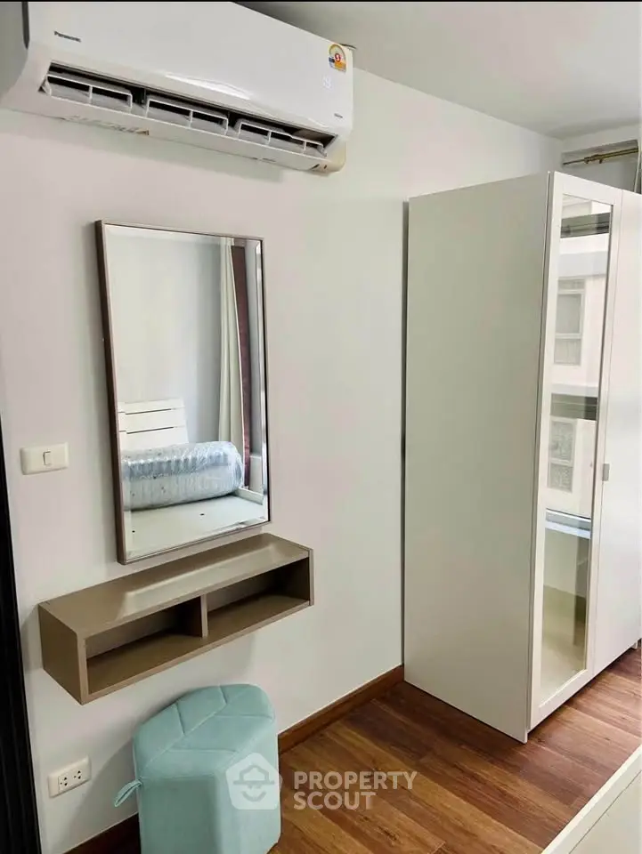 Modern bedroom with air conditioning and stylish furniture in a cozy apartment.