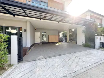 Modern house entrance with spacious driveway and sleek architectural design