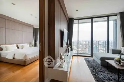 Luxurious modern apartment with spacious living room and bedroom, featuring floor-to-ceiling windows and city view.