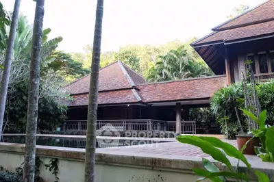 Stunning tropical villa with traditional architecture and lush greenery