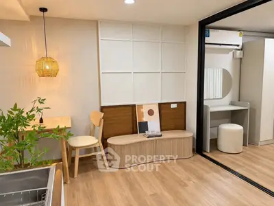 Modern interior with stylish seating and wooden flooring, perfect for cozy living spaces.