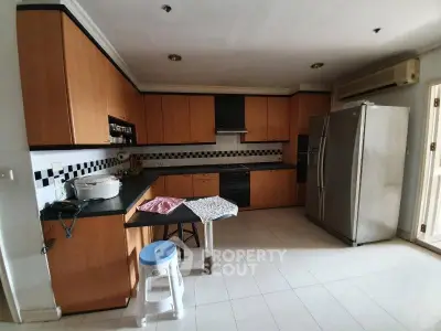 Spacious kitchen with modern appliances and ample storage in a stylish home.
