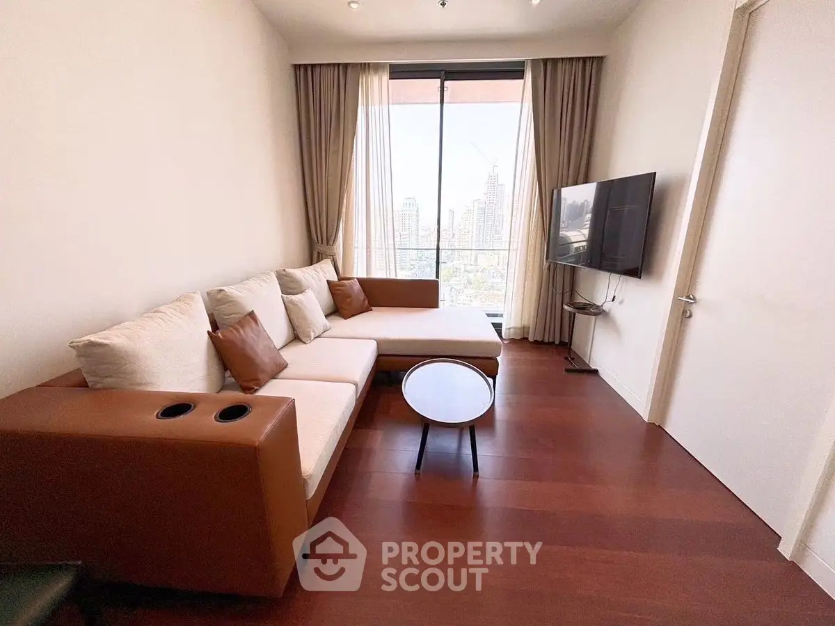 Modern living room with city view, stylish furniture, and wall-mounted TV.