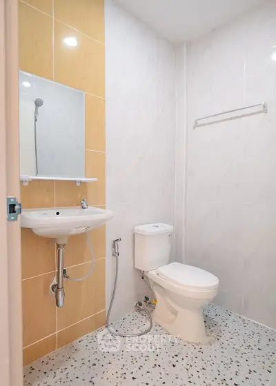 Modern bathroom with sleek fixtures and elegant tile design, perfect for a contemporary home.
