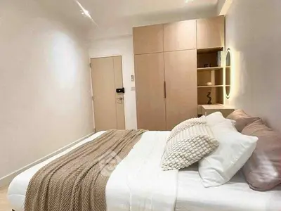 Cozy modern bedroom with stylish decor and ample storage space