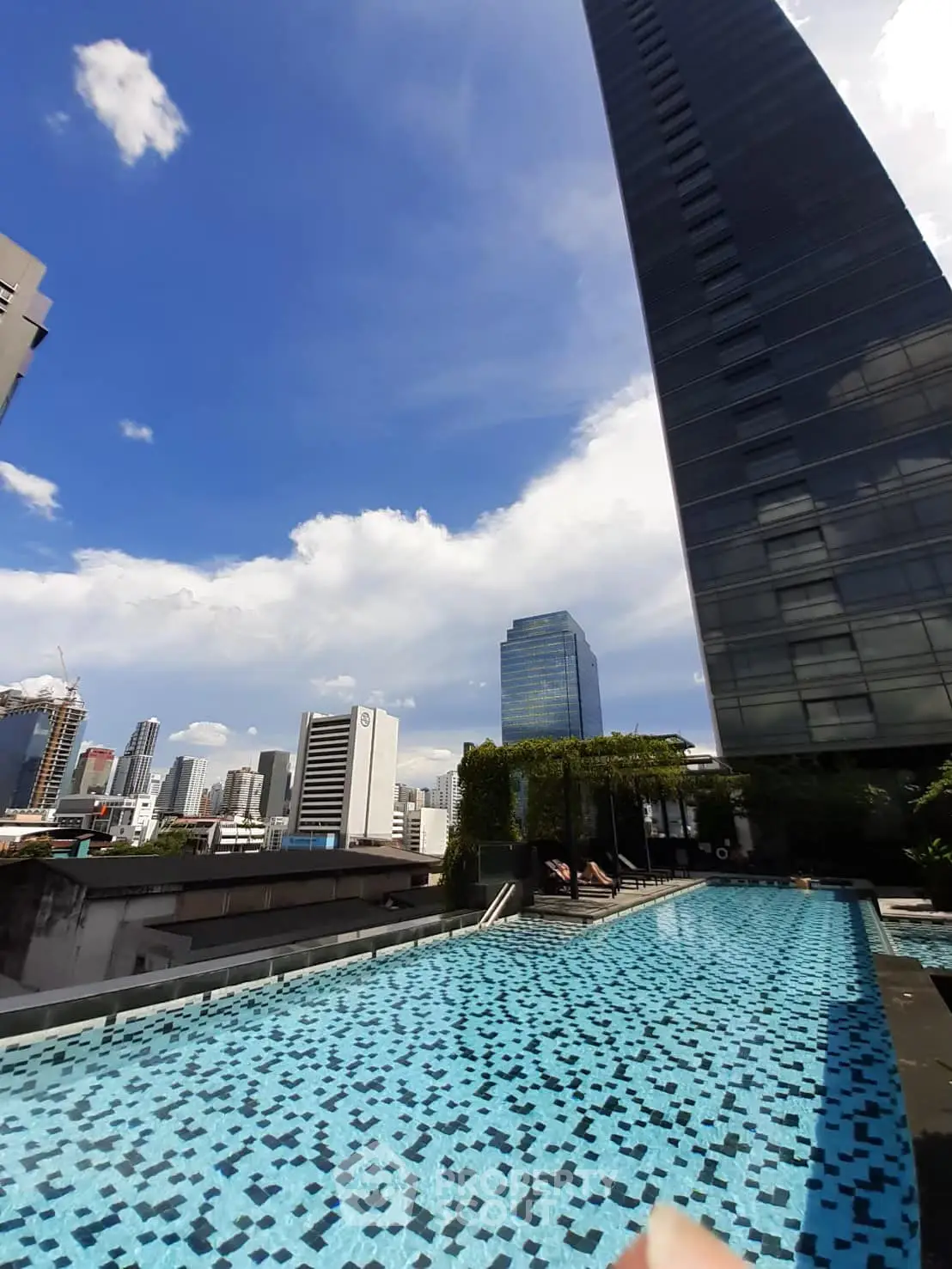 Stunning rooftop pool with breathtaking city skyline views