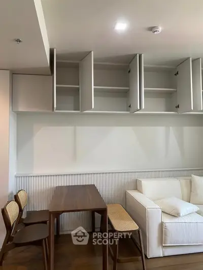 Modern living room with open cabinets and stylish furniture