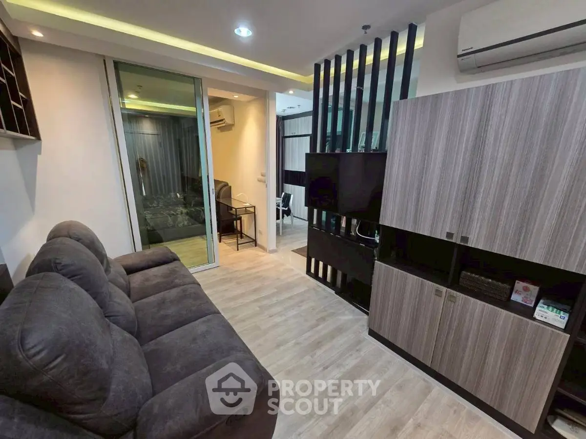 Modern living room with sleek furniture and stylish decor in a contemporary apartment.